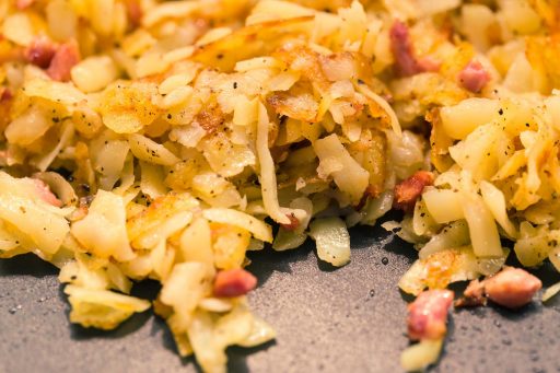 This shows hash, which is a culinary dish made by chopping and mixing onions, meat and potatoes. Hash functions work on their input to produce output that is also known as a hash.