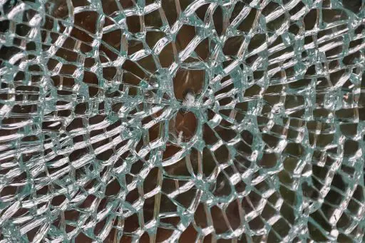 Broken glass in a window as a symbol of errors